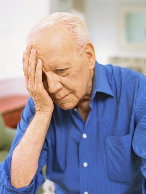 close-up of a senior man looking sad