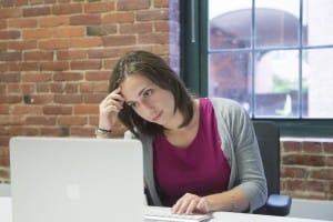 woman staring at computer