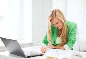 woman taking notes from an LNC conference