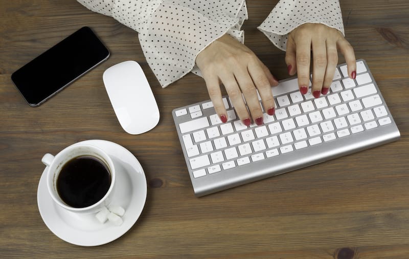 LNC woman working with computer.