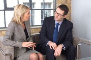 woman and man on couch discussing expert witness opinions