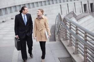 blond woman talking to attorney