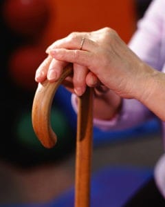 woman holding cane