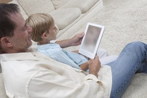 father reading stories to son