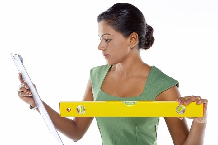 Businesswoman using a measuring device