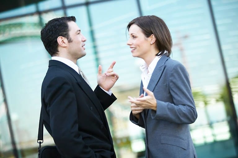 man and woman talking