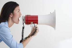 woman shouting into megaphone