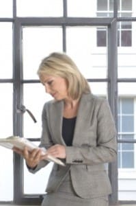 woman reading paper